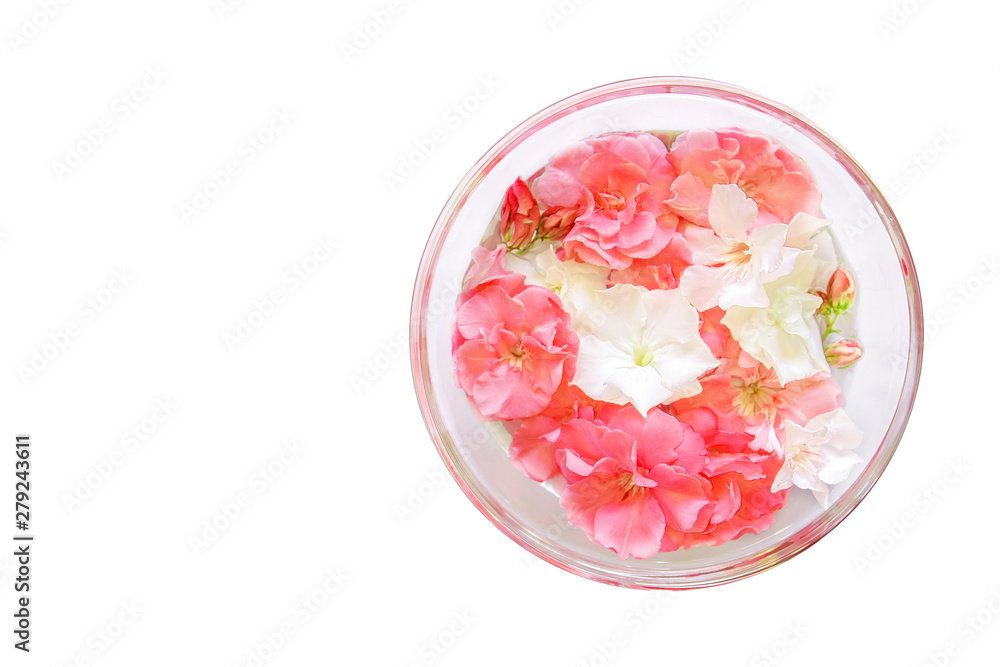 Glass plate with water and flowers, spa manicure treatment, top view, spa aroma bowl for hands Glass plate with water and flowers, spa manicure treatment, top view, spa aroma bowl for hands