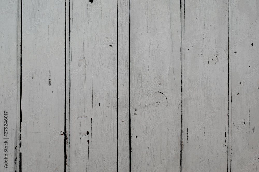Old weathered wooden plank surface painted white. Background texture.