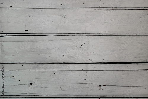 Old weathered wooden plank surface painted white. Background texture.