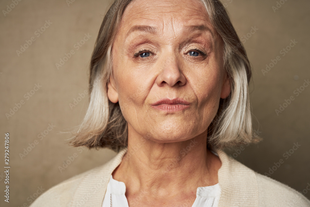 portrait of senior woman smiling at camera portrait of senior woman smiling at camera