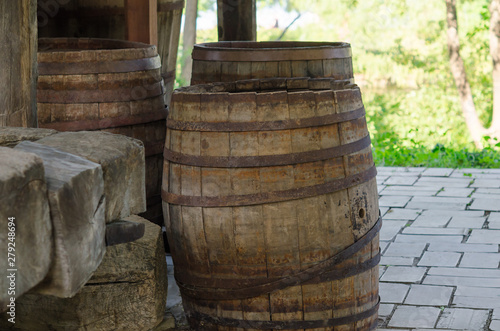 Old dusted wooden barrels used for alcohol 