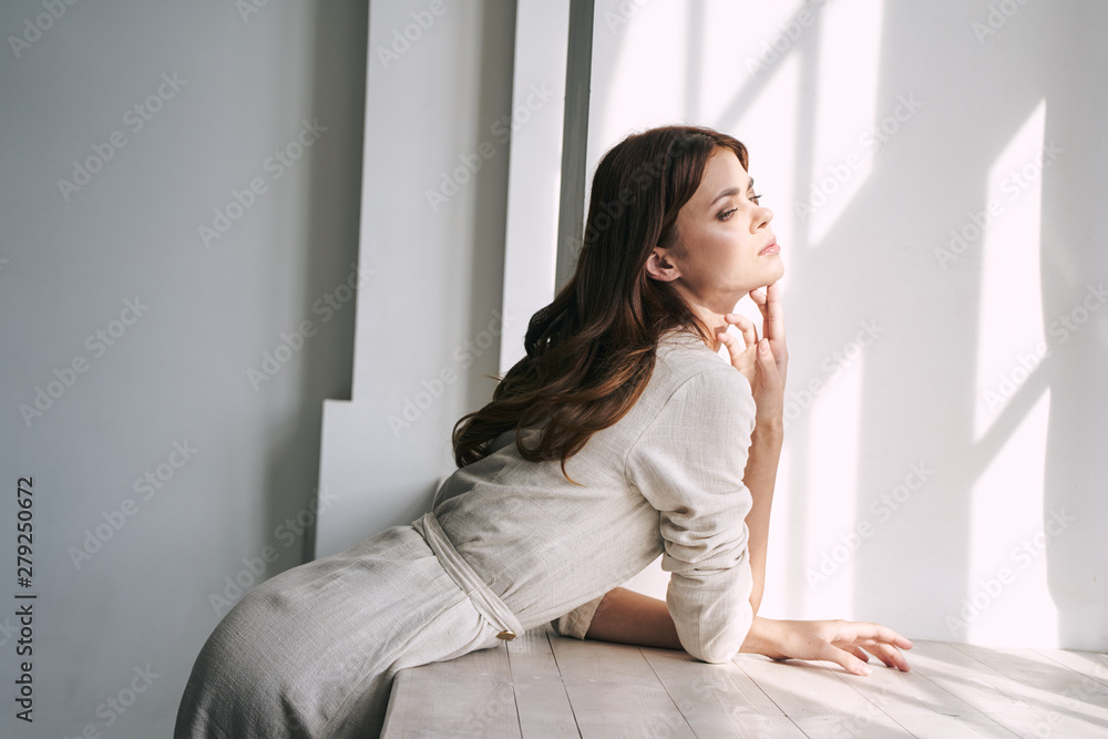 young woman sitting on sofa at home