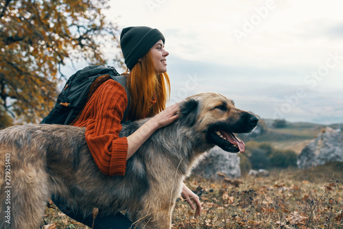 Photography woman with dog in autumn park