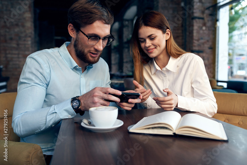 young couple having breakfast in cafe