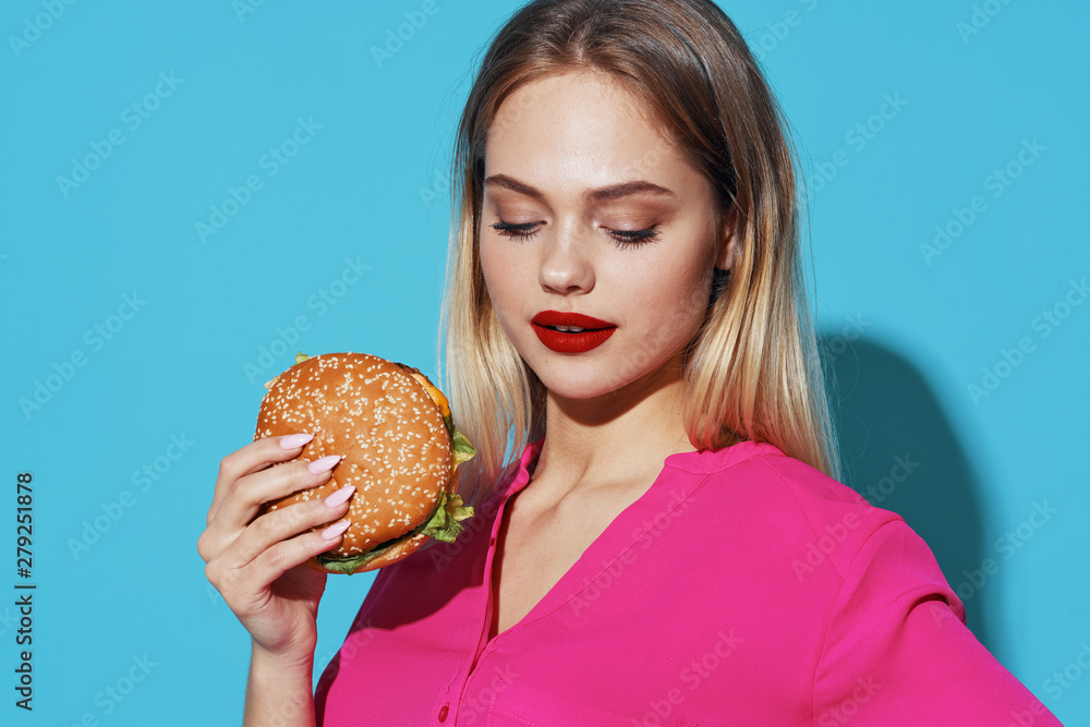 young woman with hamburger