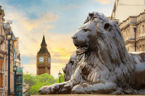 Konstfotografi Lion Sculpture at Trafalgar Square with Big Ben on the background in London, UK