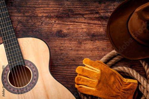 Fototapeta American culture, living on a ranch and country muisc concept theme with a cowbo