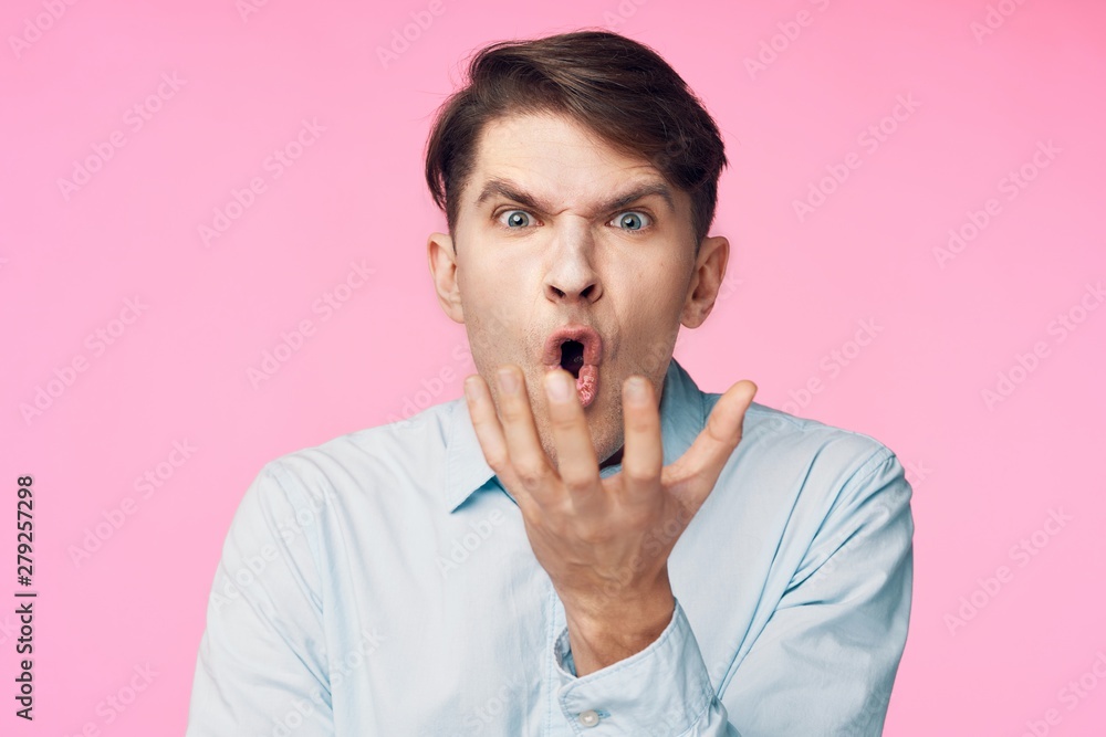 young man with his finger on her lips young man with his finger on her lips