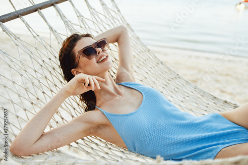 young woman relaxing on the beach © SHOTPRIME STUDIO