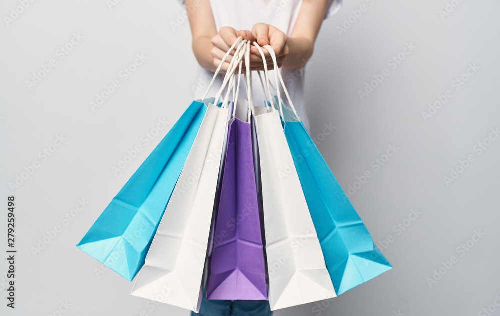 woman with shopping bags isolated on white