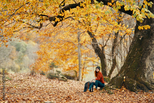 young woman in autumn forest