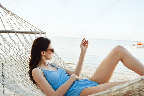 young woman relaxing on the beach © SHOTPRIME STUDIO