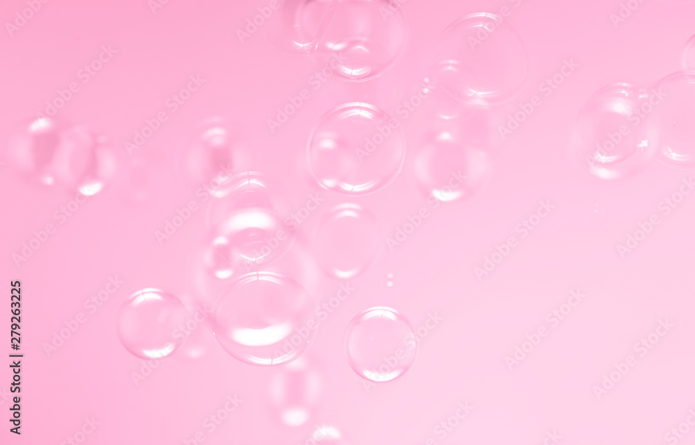 soap bubbles floating on pink background. bubbles abstract background.