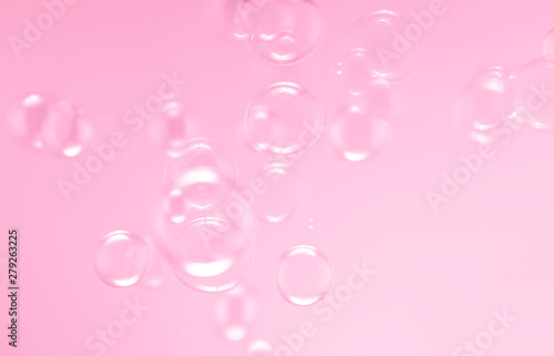 soap bubbles floating on pink background. bubbles abstract background.