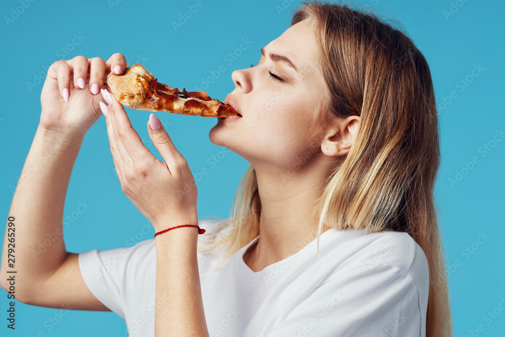 young woman eating pizza young woman eating pizza