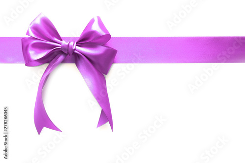 Pink ribbon with a bow as a gift on a white background