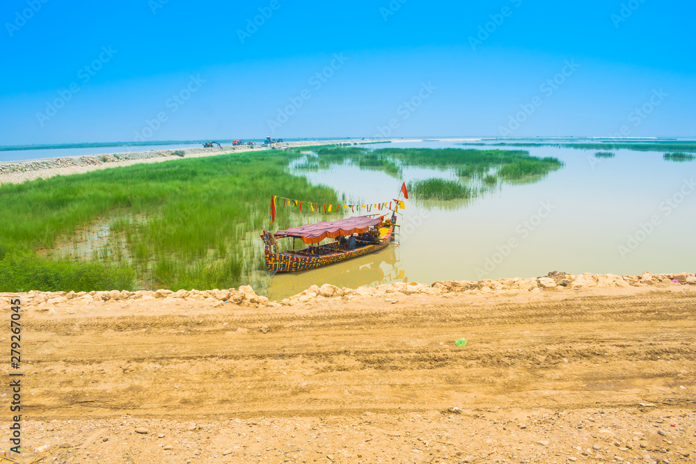 Fototapeta premium a long boat in river indus pakistan