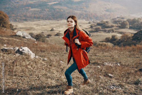 portrait of a young beautiful woman with perfect skin in mountains