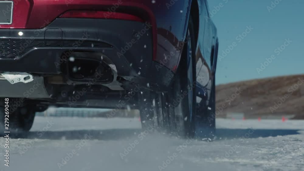 Close Up Slowmotion of Tyre Slipping on Snow. Professional Testing Tires in Cold Weather Conditions Close Up Slowmotion of Tyre Slipping on Snow. Professional Testing Tires in Cold Weather Conditions
