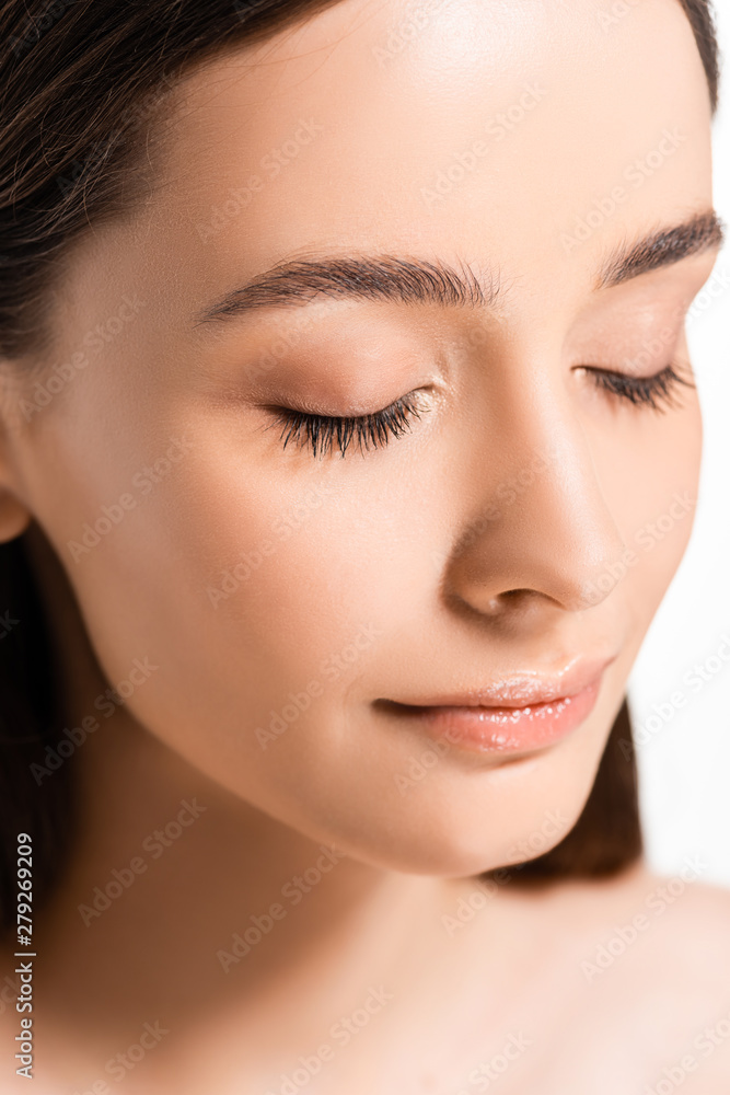 portrait of beautiful young woman with perfect skin and closed eyes isolated on white