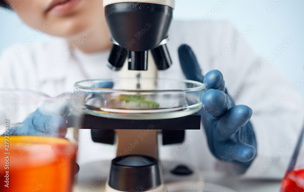 female scientist looking through microscope female scientist looking through microscope