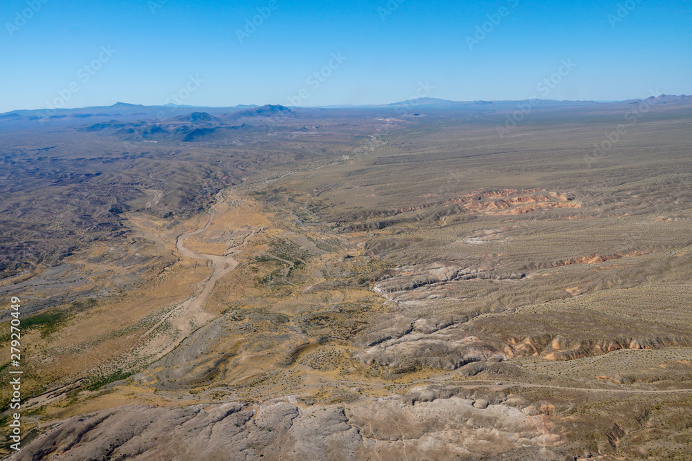  Aerial view of desert next the Lake Mead in Mohave County, Arizona, United States. Arid endless desert during hot summer season