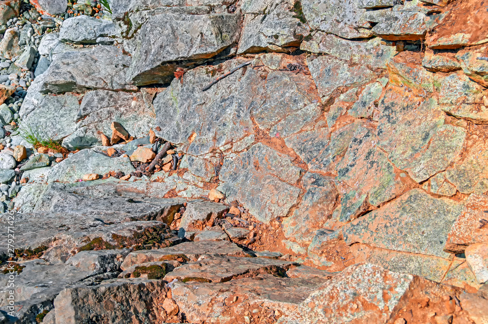 Rock background with dry earth in the cracks between the stones. Rock background with dry earth in the cracks between the stones.
