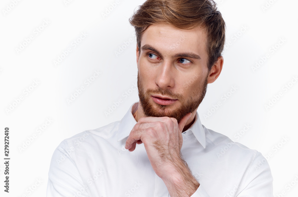 young man with his finger on lips isolated on white background young man with his finger on lips isolated on white background