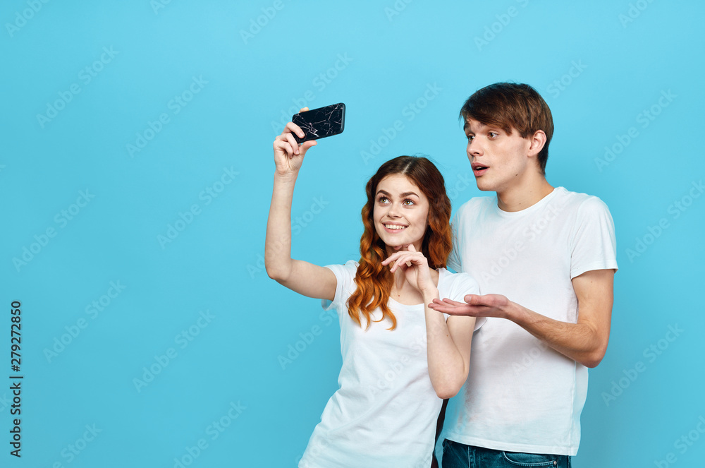 young couple taking picture of themselves with digital camera young couple taking picture of themselves with digital camera