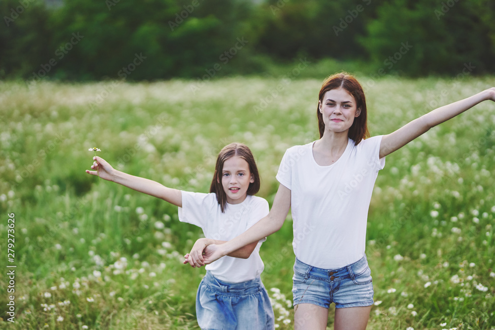 Fototapeta premium mother and daughter having fun in the park