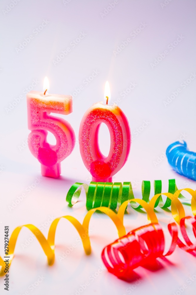 lit number candles with a ribbon lit number candles with a ribbon