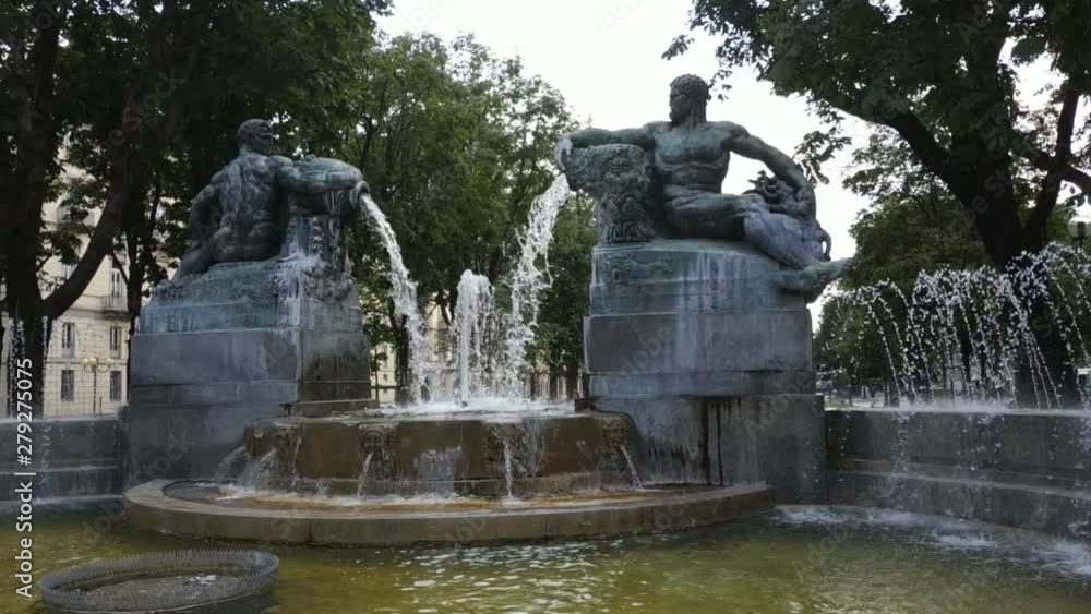 Turin, Piedmont, Italy. July 2019. Filmed with pan movement on the Angelica fountain in Piazza Solferino. The statues that compose it symbolically recall the four seasons. 30fps Turin, Piedmont, Italy. July 2019. Filmed with pan movement on the Angelica fountain in Piazza Solferino. The statues that compose it symbolically recall the four seasons. 30fps