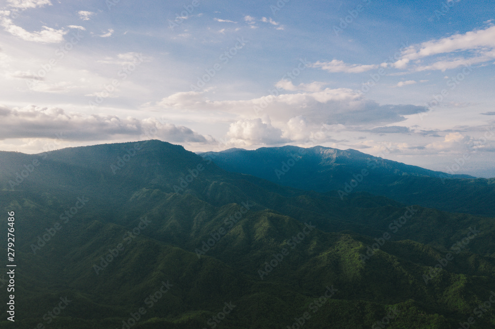 Fototapeta premium Aerial view of mountains and chewed roads on the mountain during sunset at Khao Kho Viewpoint, Phetchabun Province, Thailand