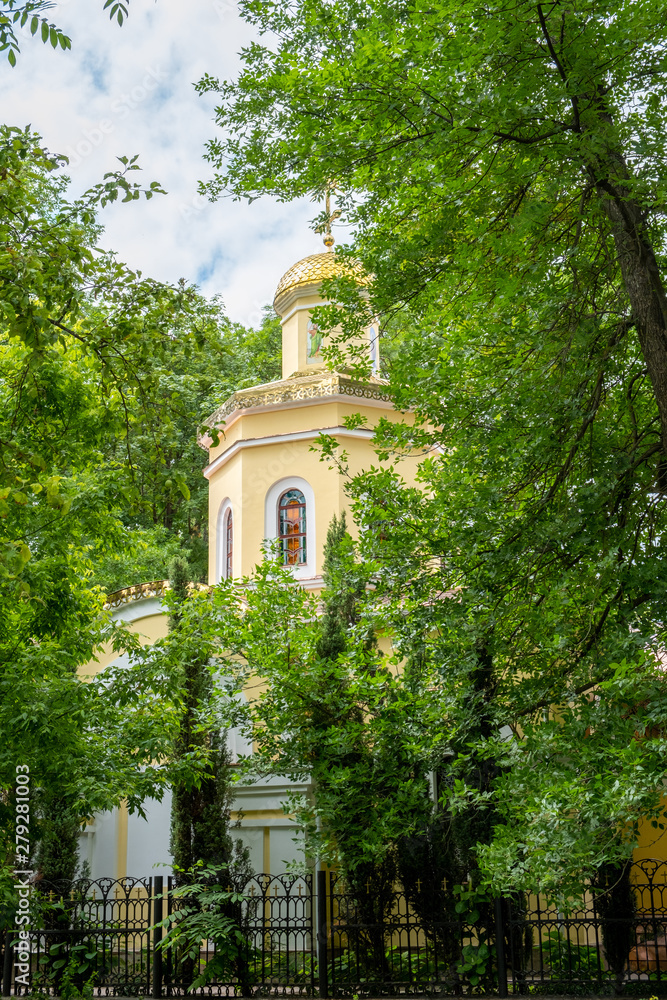 Cathedral of St Peter and St Paul in Gomel, Belarus hidden among trees in the park