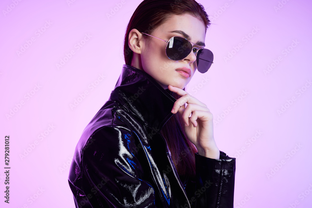 portrait of a young beautiful woman with perfect skin in neon