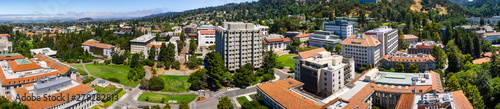 Panoramic view of the University of California, Berkeley campus on a sunny day, view towards Richmond and the San Francisco bay shoreline in the background, California