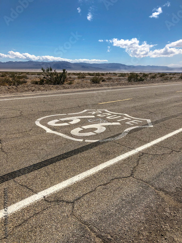 The famous Route 66 emblem painted on Route 66 in the California Desert. 