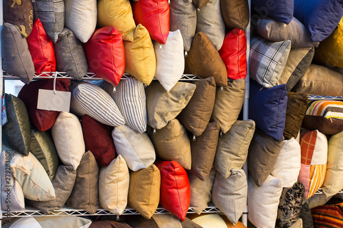 Colorful pillows placed on the floor for sale