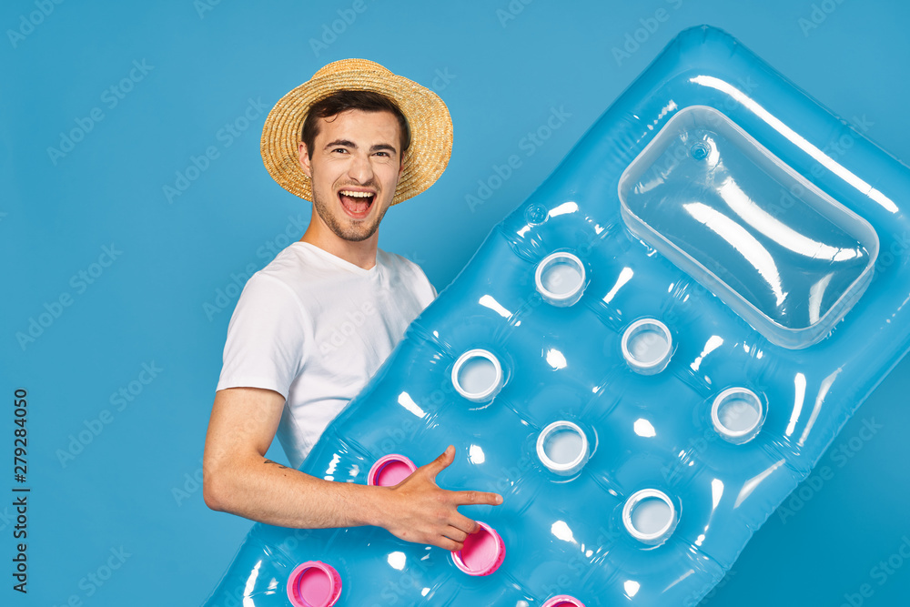 Fototapeta premium man with inflatable mattress