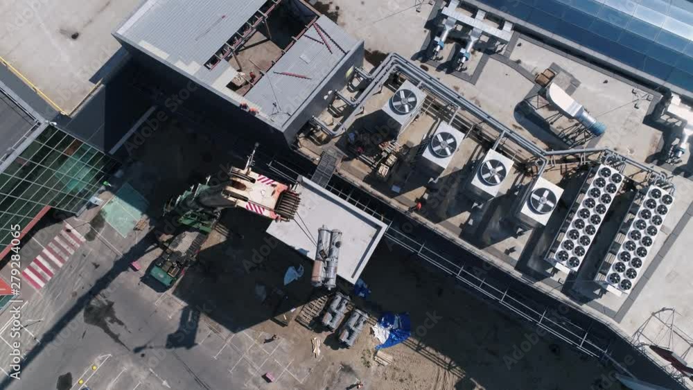 Aerial view. The air conditioning and ventilation systems on roof of huge mall. Aerial view. The air conditioning and ventilation systems on roof of huge mall.