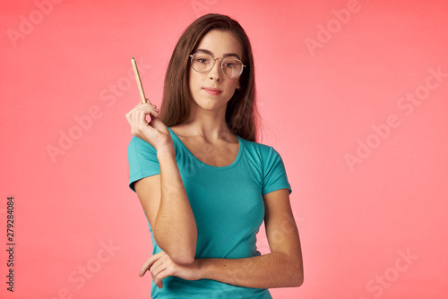 young woman with pencil and book