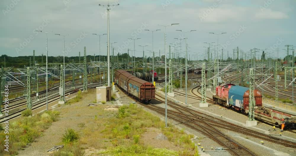 Sliding-wall Boxcar or Hi-Cap Slide Wall wagon with graffiti rolling down shunting hump Sliding-wall Boxcar or Hi-Cap Slide Wall wagon with graffiti rolling down shunting hump
