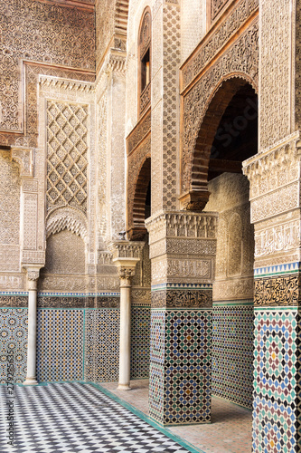 Fez, Morocco - February 23, 2019:  Interior of the Madrasa Bou Inania - ancient institute for higher education. It is famous for its Marinid architecture art. photo