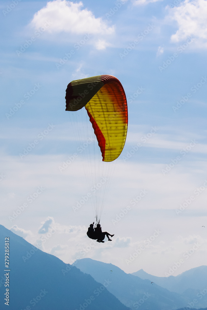 Vertical picture of tandem paragliding in Interlaken, Switzerland