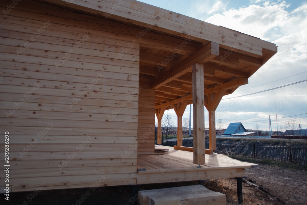 Fototapeta premium Modern eco-friendly materials. Timber house. The construction of ecological wood homes. Mortgage, loan, dream house. Country private house. interior. Layout of living rooms.