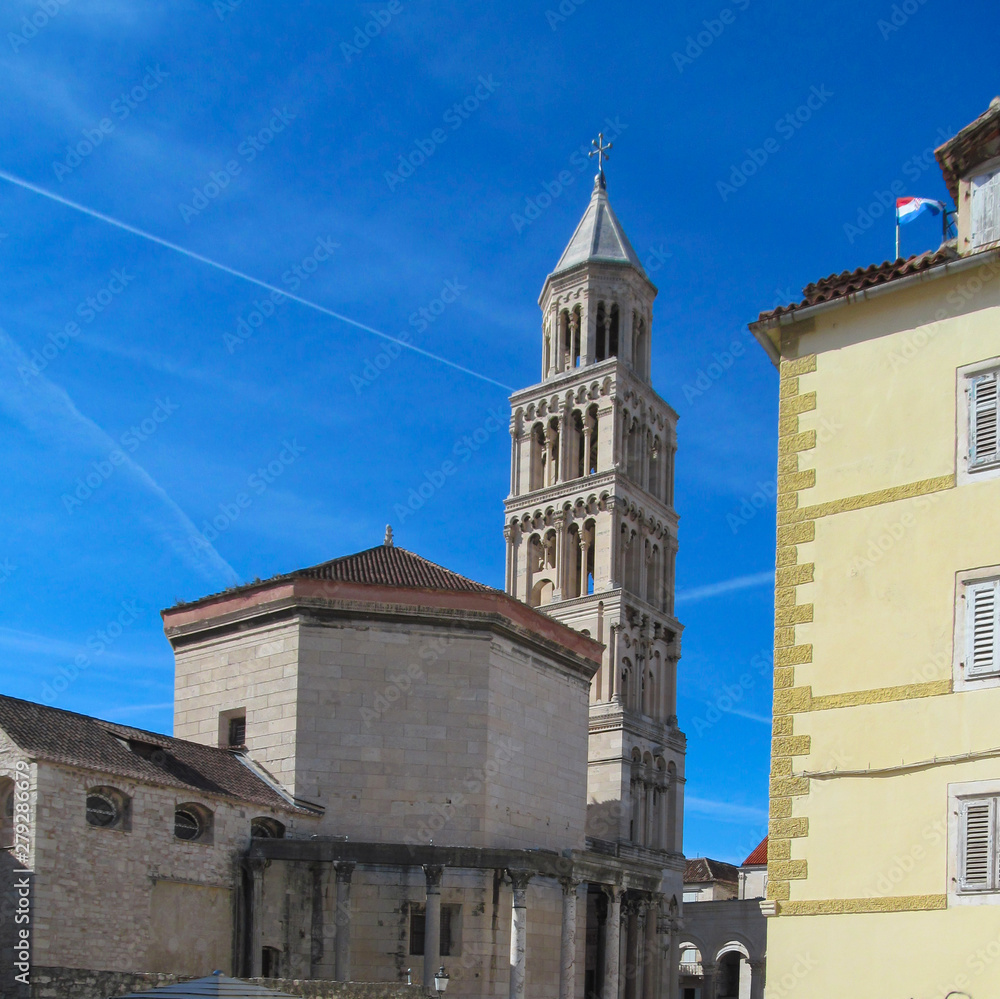 Fototapeta premium The Diocletian's Palace in Split, Croatia. Beautiful architecture of unique ancient buildings and many tourists in the old city on blue sky background on a sunny day. 