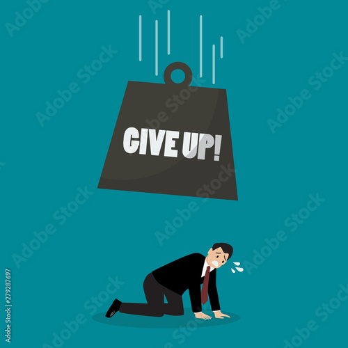 Heavy ball with word give up falling to desperate businessman