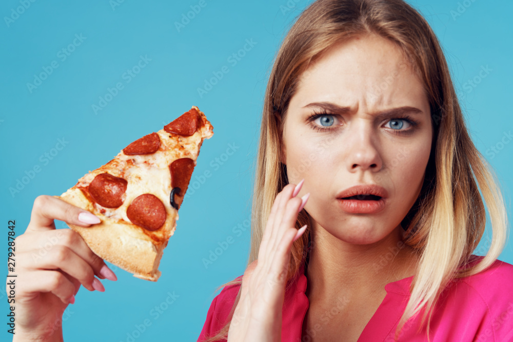 woman eating pizza