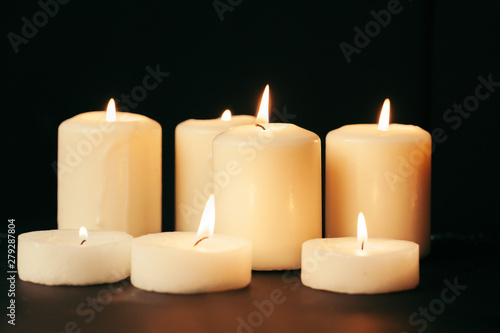 Many burning candles with shallow depth of field