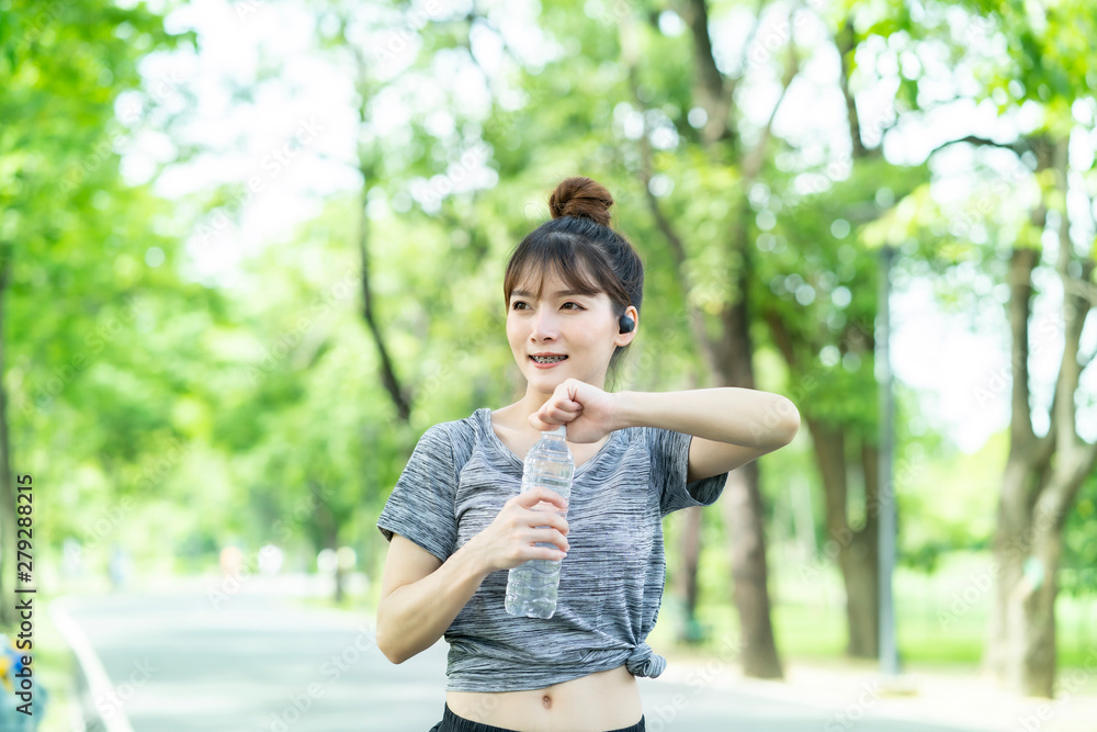 People are exercising at the park with blurry background People are exercising at the park with blurry background